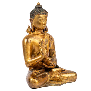 Buddha statue from Nepal  in antique medieval style. This statue was part of the exhibition in the Patan Museum: "The Revival of Newari Woodcarving, 2024".