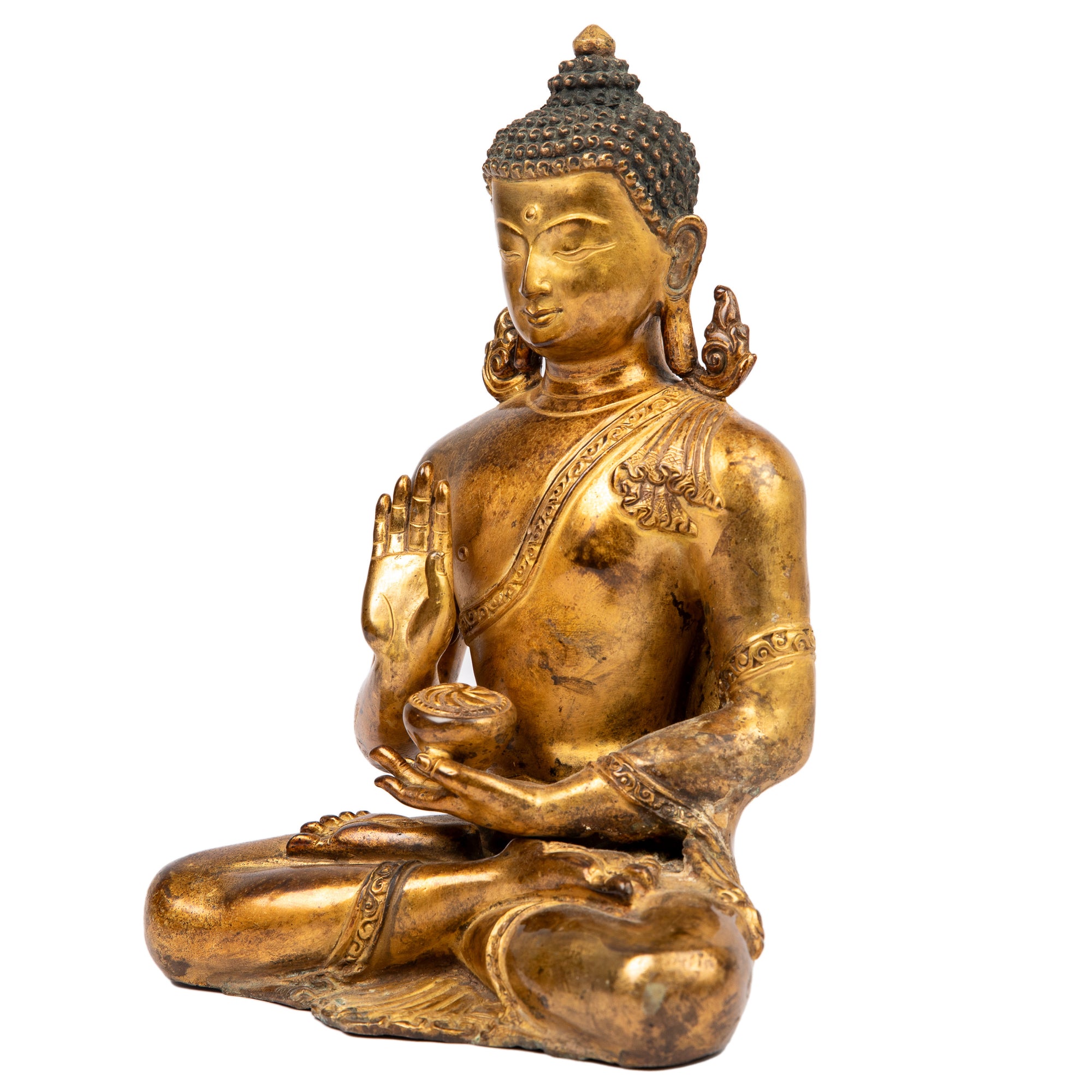 Buddha statue from Nepal  in antique medieval style. This statue was part of the exhibition in the Patan Museum: "The Revival of Newari Woodcarving, 2024".