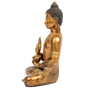 Buddha statue from Nepal  in antique medieval style. This statue was part of the exhibition in the Patan Museum: "The Revival of Newari Woodcarving, 2024".