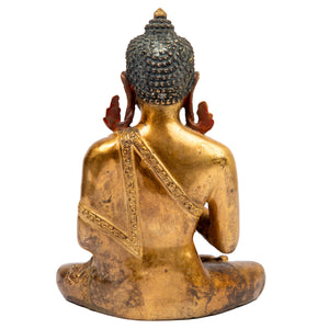 Buddha statue from Nepal  in antique medieval style. This statue was part of the exhibition in the Patan Museum: "The Revival of Newari Woodcarving, 2024".