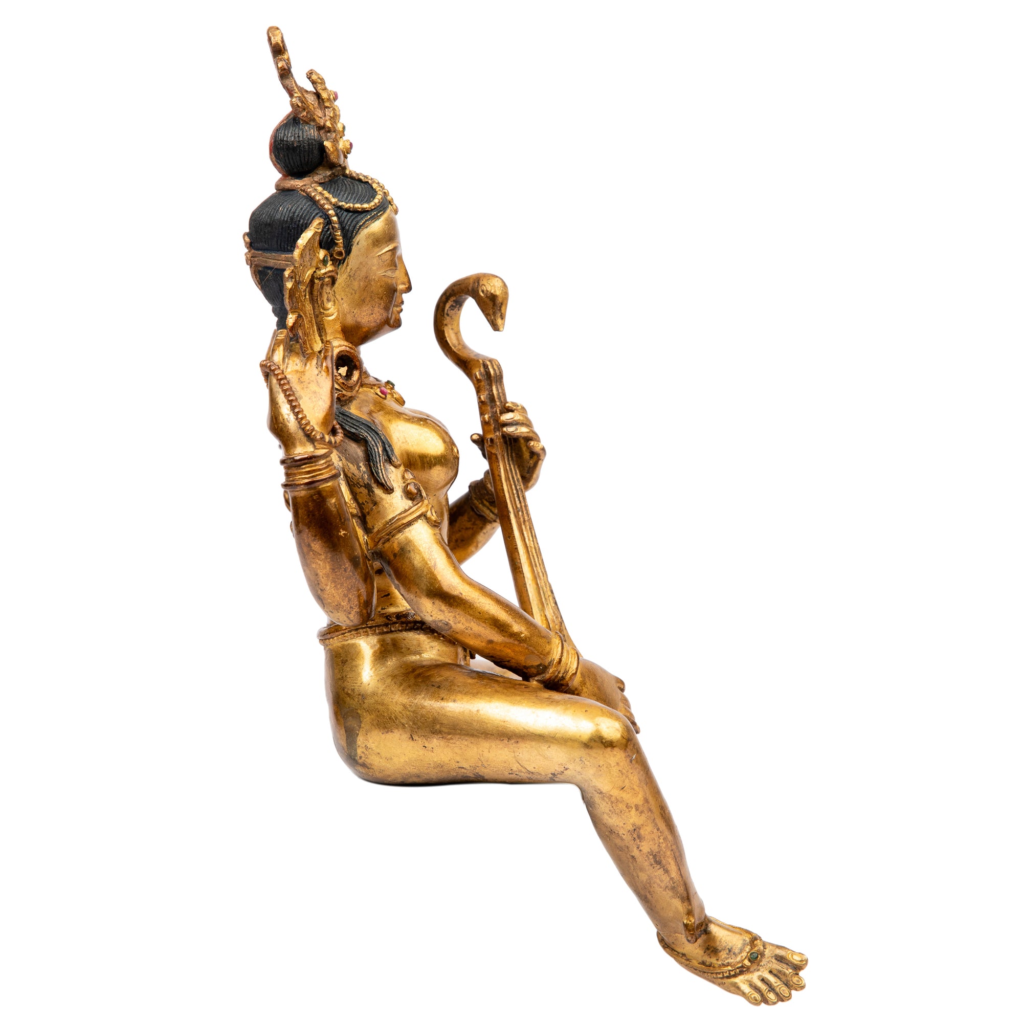 Bronze statue from Nepal in antique medieval style. Worshipped by Hindus as well as Buddhists, Saraswati is the goddess of art, knowledge, learning, wisdom and music.