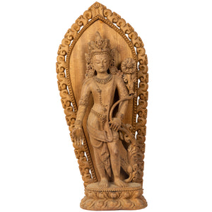 Woodcarving from Bhaktapur, Nepal. Padmapani (“The Lotus-Bearer”)  is an emanation of Avalokiteshwara, the Boddhisattva of Compassion. This statue was part of the exhibition in the Patan Museum: "The Revival of Newari Woodcarving, 2024".