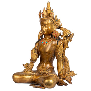 Bodhisattva bronze — left side view showing raised right hand in Abhaya mudra.
