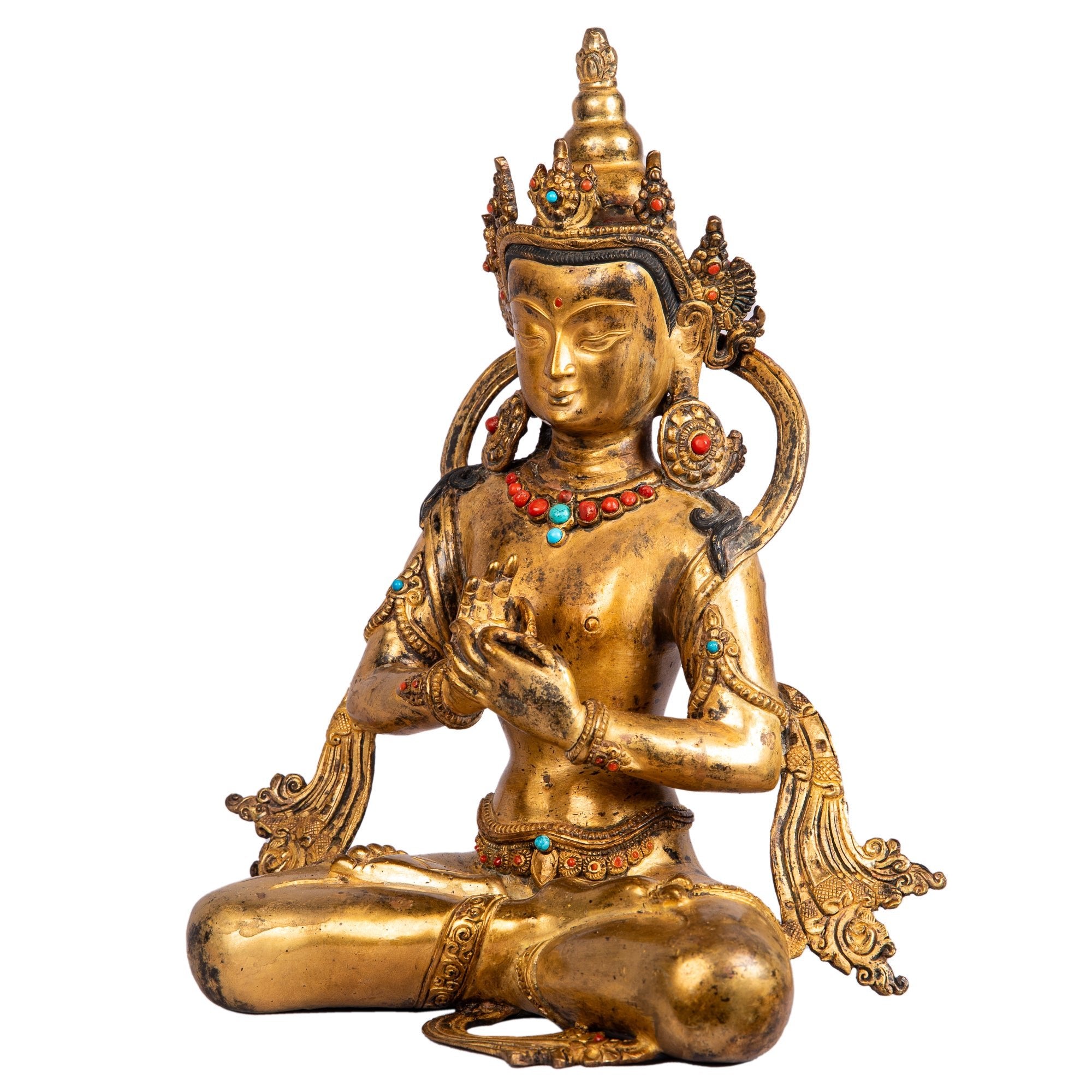 Bodhisattva bronze — left side view showing crown and gesture of teaching.