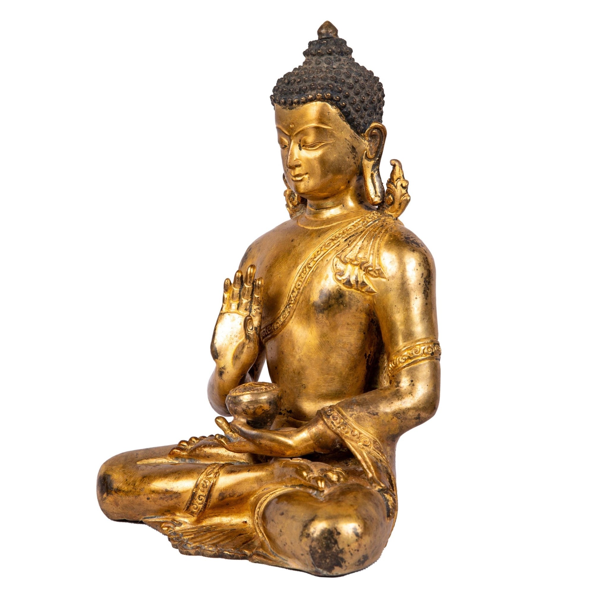 Left side view showing raised hand of protection and robe folds.