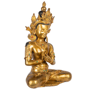 Crowned bodhisattva dharmachakra mudra gilt copper statue angle view Himalayan art Nepal