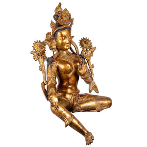 Green Tara bronze statue — right side view highlighting the gesture of compassion and gold gilded jewelry.
