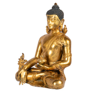 Medicine Buddha holding myrobalan plant gilt copper bronze statue side view Himalayan art Nepal